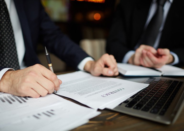 businessman-reading-contract-closeup